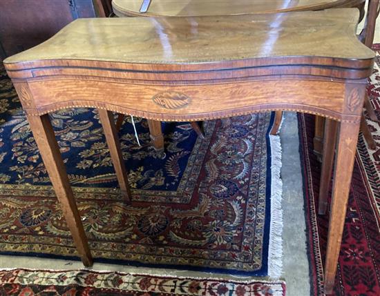 A George III inlaid satinwood folding-top serpentine card table, width 88cm, depth 45cm, height 76cm